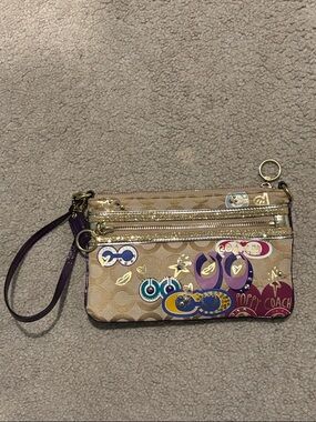 Coach Beige Signature Wristlet with Purple and Gold Accents